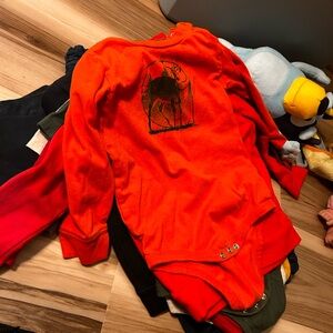 Orange Long-Sleeve Baby Onesie with Black Graphic